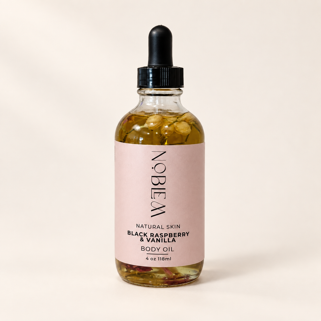 Black Raspberry &amp; Vanilla Body Oil on a warm ivory background