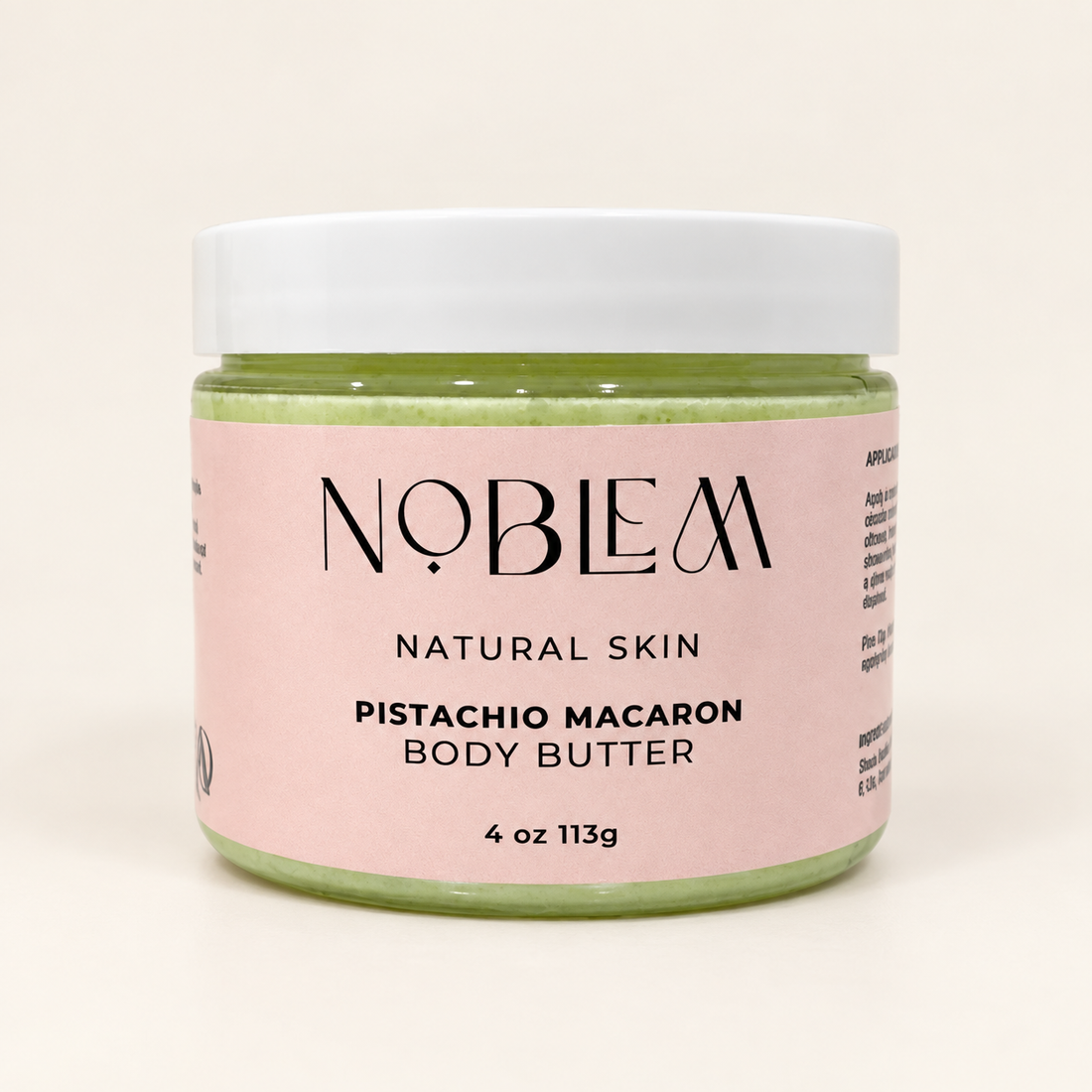 Noblem Pistachio Macaron Body Butter on an ivory background