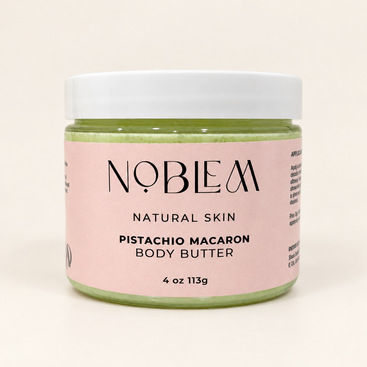 Noblem Pistachio Macaron Body Butter on an ivory background