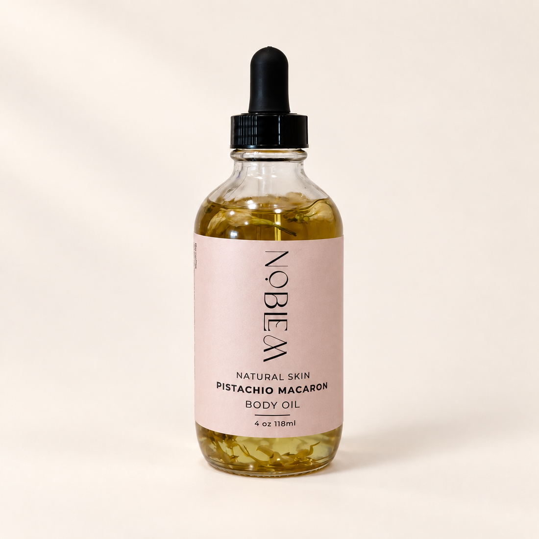 Pistachio Macaron Body Oil on a warm ivory background