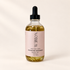Pistachio Macaron Body Oil on a warm ivory background