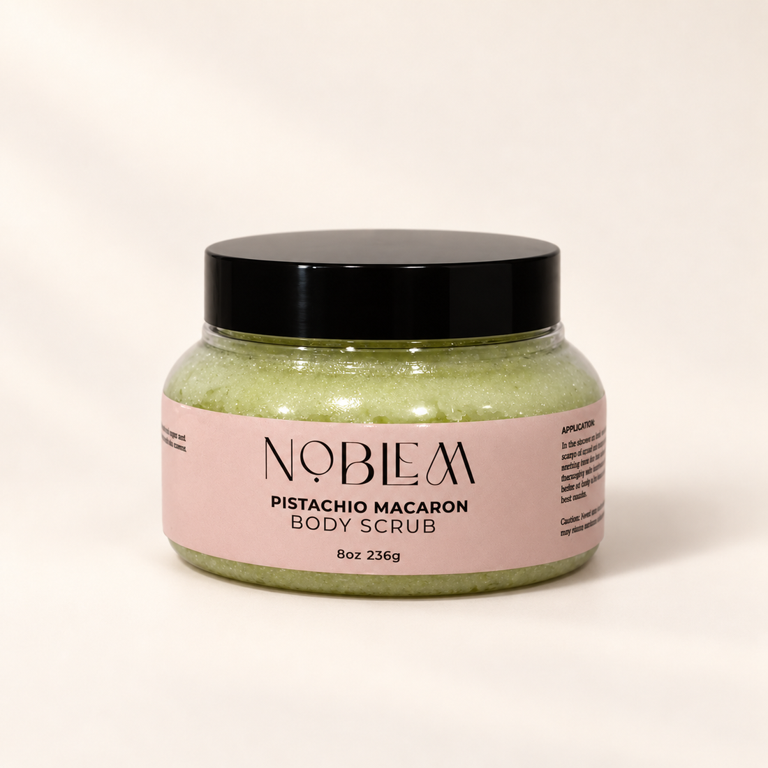 Pistachio Macaron Body Scrub on a warm ivory background